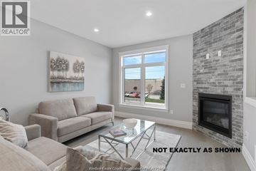 Lakeshore townhouse for rent - A living room with a couch, coffee table, and a painting on the wall.