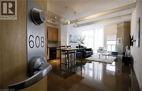 Hamilton condo for rent - A modern apartment with a glass door and a number plate on it.