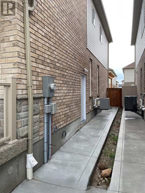 Kitchener apartment for rent - A brick building with a sign that says REALTOR.