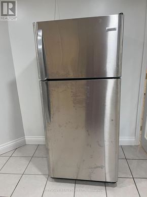 Hamilton (Winona Park) apartment for rent - A silver fridge with a white door is in a room.