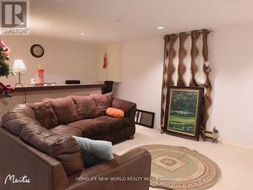 Toronto (Bayview Village) apartment for rent - A living room with a brown leather couch and a painting on the wall.