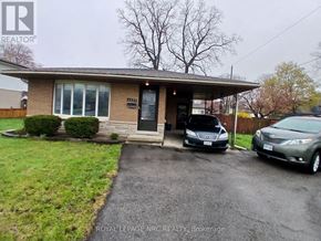 Niagara Falls (Morrison) apartment for rent - A house with a Royal LePage REALTY sign in front.