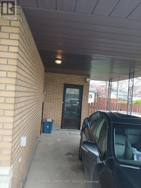 Niagara Falls (Morrison) apartment for rent - A black car is parked in a garage.