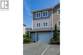 St. John's house for rent - A house with a grey roof and a blue garage door.