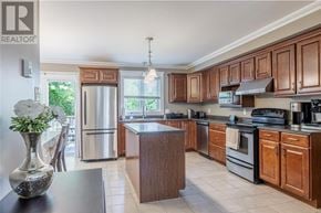 St. John's house for rent - A kitchen with wooden cabinets and a refrigerator.
