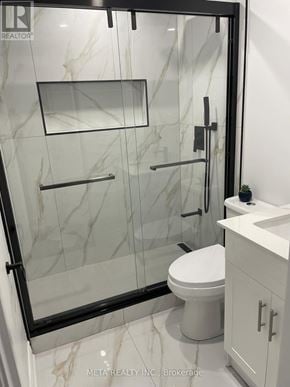 Whitchurch-Stouffville (Stouffville) apartment for rent - A bathroom with a marble floor and a walk-in shower.