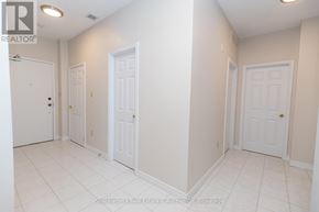 Stratford multi-family for rent - A white room with three doors and a realtor logo.