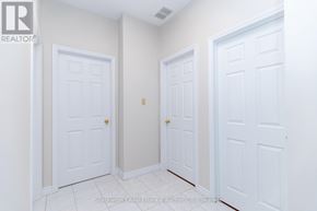 Stratford multi-family for rent - Three white doors in a hallway with a logo in the corner.