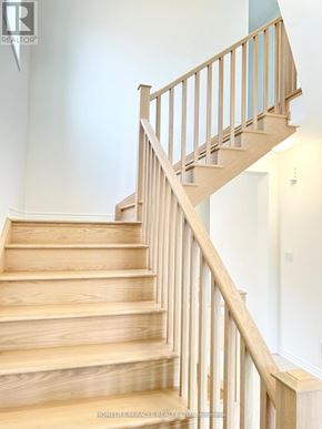Kitchener apartment for rent - A wooden staircase with a balustrade.