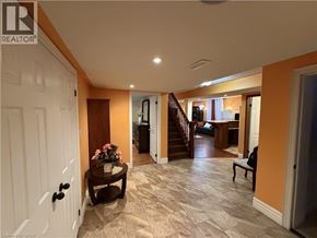 Hamilton apartment for rent - A living room with a staircase leading to the second floor.