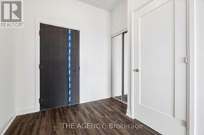 Toronto (Mount Pleasant West) condo for rent - A room with a black door and a white door.