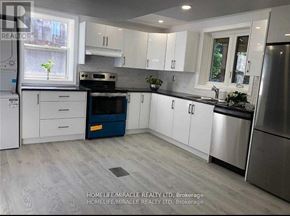 Richmond Hill (Bayview Hill) apartment for rent - A kitchen with white cabinets and a stainless steel refrigerator.