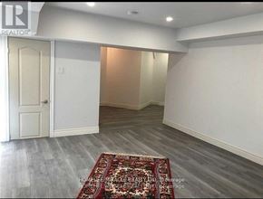 Richmond Hill (Bayview Hill) apartment for rent - A room with a rug on the floor and a door on the left.