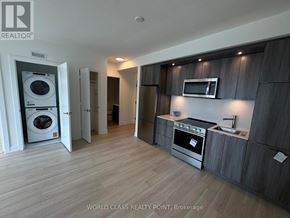Toronto (Islington-City Centre West) condo for rent - A modern kitchen with wooden cabinets and stainless steel appliances.