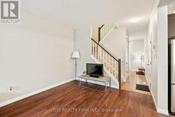 London North (North B) house for rent - A living room with a television and a staircase.