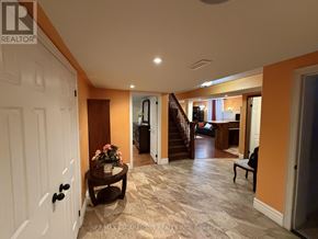 Hamilton (Jerome) apartment for rent - A hallway with a white door and a table with flowers on it.