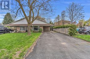 New Tecumseth (Alliston) apartment for rent - A house with a driveway in front of it.