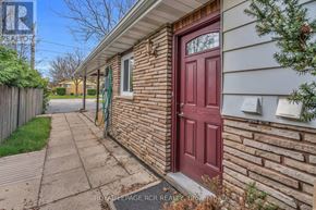 New Tecumseth (Alliston) apartment for rent - A house with a red door and a sign that says "Royal LePage Realty".