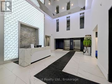 Grimsby (Grimsby Beach) condo for rent - A reception area with a marble counter and a large painting on the wall.