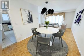 Toronto (Malvern) apartment for rent - A modern dining room with a round table and chairs.