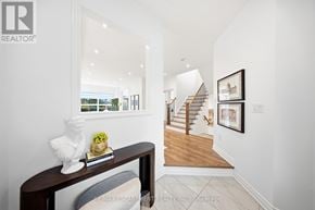 Mississauga (Churchill Meadows) apartment for rent - A white room with a wooden bench and a framed picture on the wall.