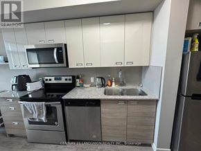 Waterloo condo for rent - A kitchen with a stainless steel oven and microwave.
