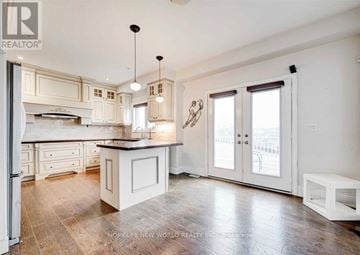 Aurora apartment for rent - A spacious kitchen with white cabinets and a large island.
