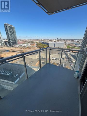 Vaughan (Concord) condo for rent - A view from a balcony overlooking a cityscape.