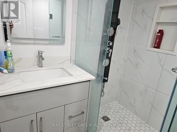 Mississauga (Erin Mills) apartment for rent - A white sink in a bathroom with a glass shower door.