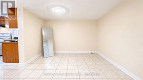 Toronto (Thistletown-Beaumonde Heights) apartment for rent - A room with a refrigerator and a cabinet.