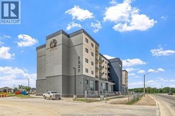 Lasalle condo for rent - A large grey building with a logo on the top left corner and the number 733 on the right side.