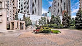 Toronto (Willowdale East) condo for rent - A roundabout in the middle of a city with buildings in the background.
