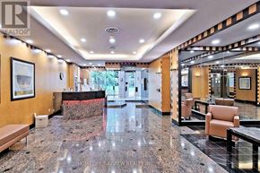 Toronto (Willowdale East) condo for rent - A spacious lobby with a marble floor and a reception desk.