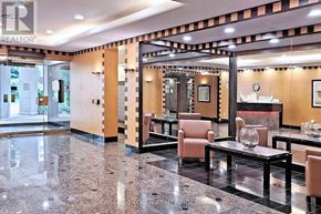 Toronto (Willowdale East) condo for rent - A well-lit, modern lobby with a marble floor and a glass wall.