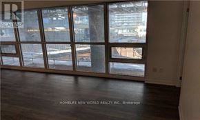 Toronto (Henry Farm) condo for rent - A room with a view of a parking lot through the windows.