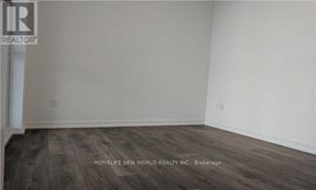 Toronto (Henry Farm) condo for rent - A room with wooden flooring and a white wall.