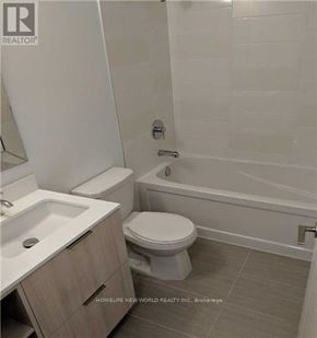Toronto (Henry Farm) condo for rent - A white toilet sits next to a white sink in a bathroom.
