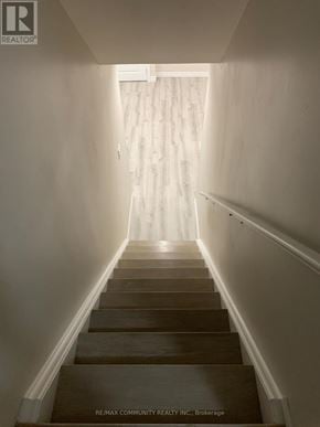 Ajax (Northeast Ajax) apartment for rent - A long flight of stairs leading to a bright room.