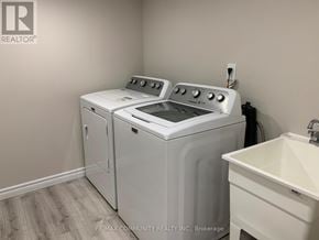 Ajax (Northeast Ajax) apartment for rent - A white washer and dryer in a laundry room.