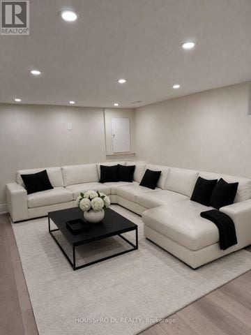 Richmond Hill (Harding) apartment for rent - A modern living room with a white sofa and a coffee table.