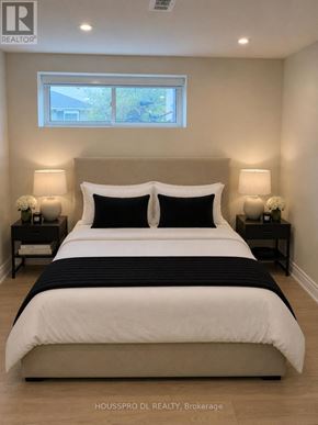 Richmond Hill (Harding) apartment for rent - A bedroom with a large bed and two nightstands.