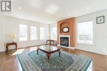 Orillia apartment for rent - A living room with a fireplace and a rug on the floor.