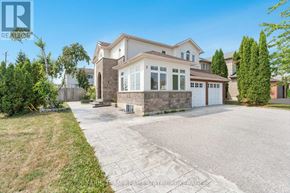 Orillia apartment for rent - A large house with a driveway in front of it.