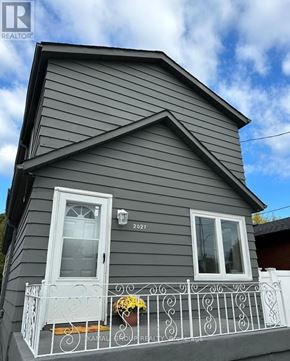 Hamilton (Parkview) apartment for rent - A grey house with a white door and window.