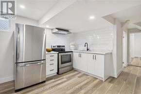 Hamilton (Parkview) apartment for rent - A modern kitchen with a refrigerator, oven, and sink.