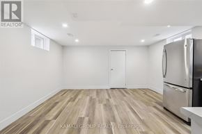 Hamilton (Parkview) apartment for rent - A kitchen with a refrigerator and wooden flooring.