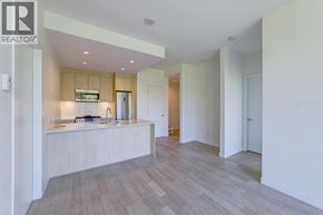 Burnaby apartment for rent - A modern kitchen with a wooden countertop and a sink.