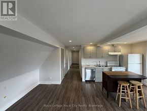 Guelph (Exhibition Park) apartment for rent - A kitchen with a bar stool and a countertop.