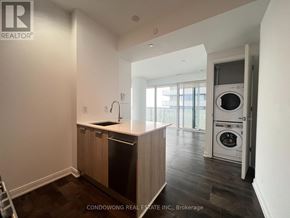 Toronto (Church-Yonge Corridor) condo for rent - A small kitchen with a dishwasher and a washing machine.