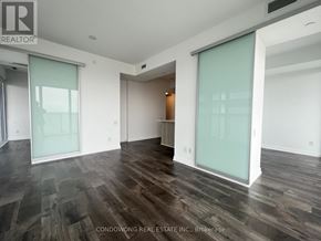 Toronto (Church-Yonge Corridor) condo for rent - A room with wood flooring and glass doors.